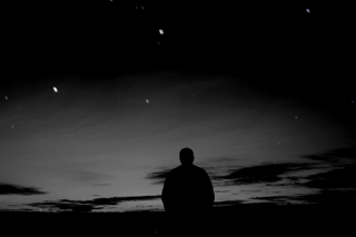 man staring into the sky